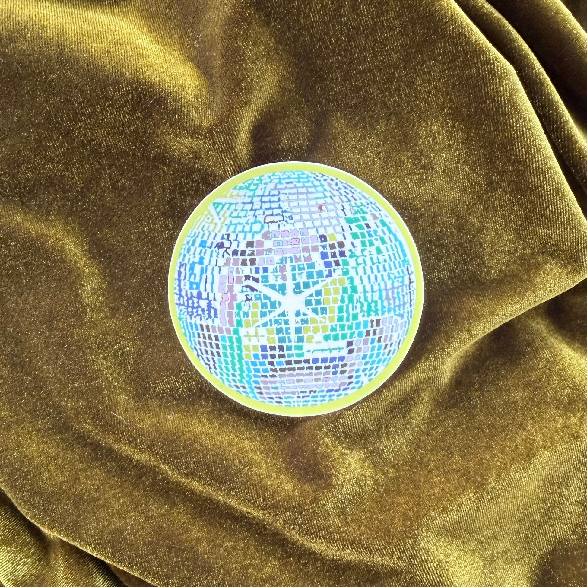 Discoball on a green velvet surface